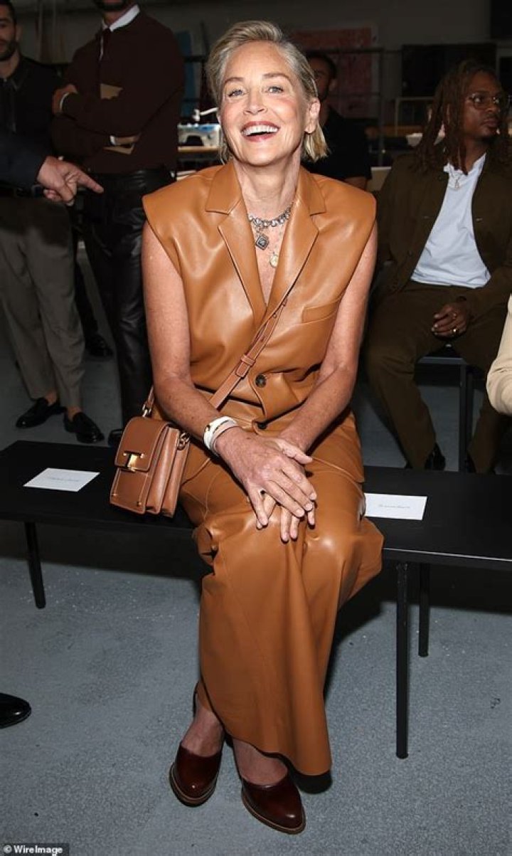 Sharon Stone sitting in front of one of her paintings in a photo shared on Instagram
